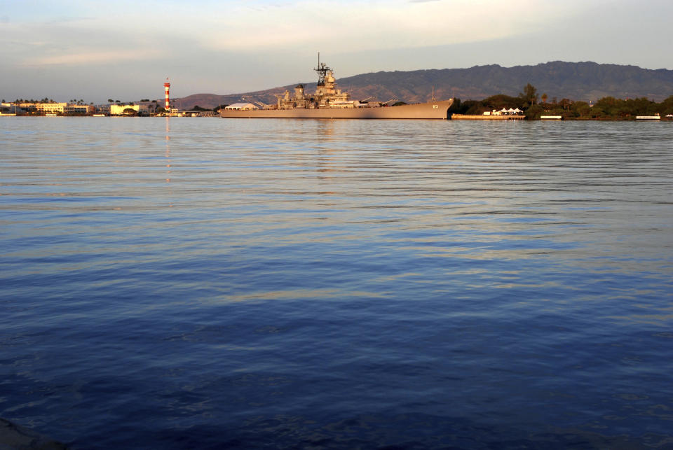 FILE - In this Dec. 7, 2016, file photo, the USS Missouri is shown on the 75th anniversary of the Japanese attack in Pearl Harbor, Hawaii. Some veterans and government officials will gather on the Missouri on Wednesday, Sept. 2, 2020, in Hawaii to mark the 75th anniversary of the surrender. (AP Photo/Caleb Jones, File)