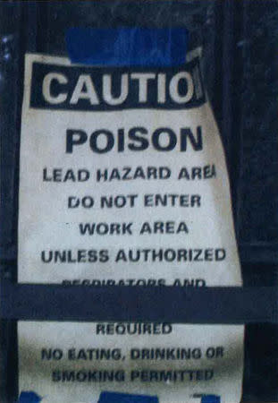 FILE PHOTO: A sign warns of a lead hazard at a residence in Fort Benning, Georgia, U.S. in this undated handout photo obtained by Reuters August 15, 2018. Georgia Environmental Protection Division/Handout via REUTERS