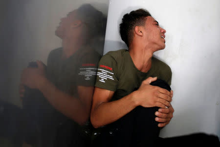 The brother of a Palestinian, who was killed at the Israel-Gaza border, reacts at a hospital in Gaza City June 18, 2018. REUTERS/Mohammed Salem