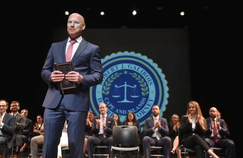 District Attorney Robert Galibois is flanked by his staff as he thanks the crowd at Cape Cod Community College at his swearing-in ceremony for the new Cape and Islands District Attorney and his assistants in January.