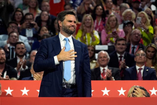 JD Vance places his hand on his chest at the Republican National Convention