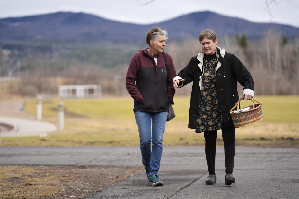 Morgan Baumann, left, and Lyndall Heyer, arrive for the annual Town Meeting in the mountain town of Stowe, Vt., Tuesday, March 5, 2024. Town meetings give residents a chance to talk, listen, debate and vote. Many people who attend town meetings say the tone is refreshingly civil when compared with the nastiness of national politics because people are debating issues with their neighbors face-to-face. (AP Photo/Robert F. Bukaty)