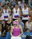 Supporters of Russia's Maria Sharapova are pictured behind her in between games during her womens' singles semi-final loss to Serena Williams of the U.S. at the Brisbane International tennis tournament in Brisbane, January 3, 2014. REUTERS/Jason Reed