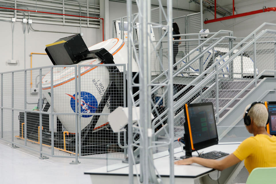 Immersive simulation technology, such as the "Land-and-Drive-on-Mars" full-motion simulator seen here, provide a high-tech authenticity to the new Astronaut Training Experience (ATK) Center at NASA’s Kennedy Space Center Visitor Complex in Florida. <cite>Kennedy Space Center Visitor Complex</cite>