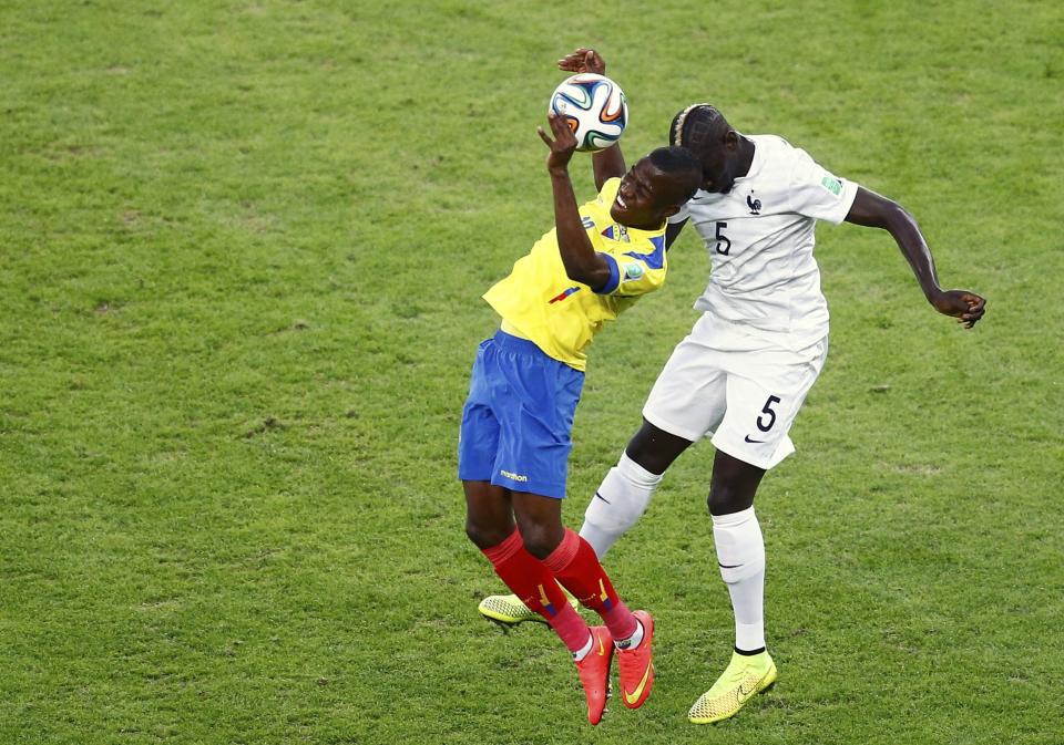 France's Mamadou Sakho (R) challenges Ecuador's Enner Valencia as they fight for the ball during their 2014 World Cup Group E soccer match at the Maracana stadium in Rio de Janeiro June 25, 2014. REUTERS/Ricardo Moraes