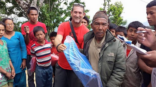 Distributing tarps to a remote village in the Sindhupalchok district. Photo: Steve Pineapple Alberts
