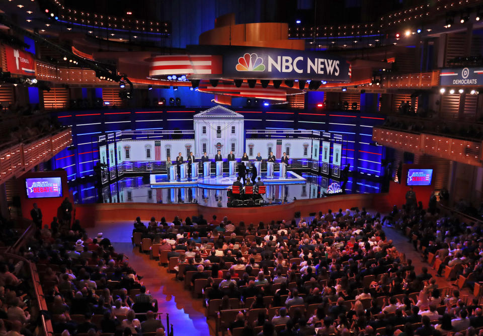 Democratic presidential candidates, author Marianne Williamson, former Colorado Gov. John Hickenlooper, entrepreneur Andrew Yang, South Bend Mayor Pete Buttigieg, former Vice President Joe Biden, Sen. Bernie Sanders, I-Vt., Sen. Kamala Harris, D-Calif., Sen. Kirsten Gillibrand, D-N.Y., former Colorado Sen. Michael Bennet, and Rep. Eric Swalwell, D-Calif., listen to a question during a Democratic primary debate hosted by NBC News at the Adrienne Arsht Center for the Performing Arts, Thursday, June 27, 2019, in Miami. (AP Photo/Wilfredo Lee)