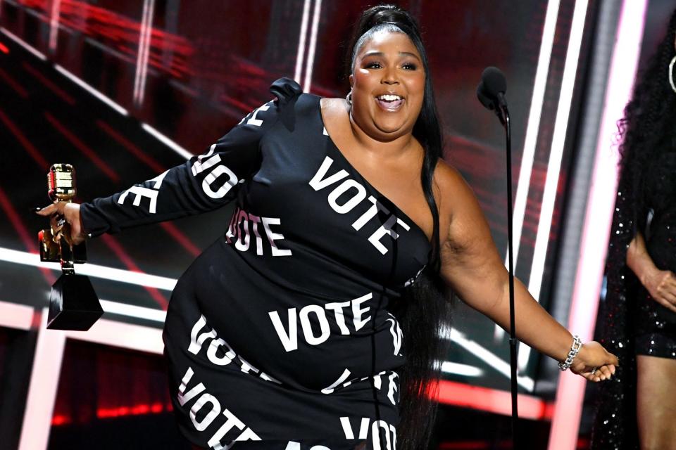 <p>Lizzo <a href="https://people.com/politics/all-the-ways-celebrities-are-helping-get-out-the-vote/" rel="nofollow noopener" target="_blank" data-ylk="slk:encourages fans to vote;elm:context_link;itc:0;sec:content-canvas" class="link ">encourages fans to vote</a> while accepting the top song sales artist award during the <a href="https://people.com/music/billboard-music-awards-2020-winners-list/" rel="nofollow noopener" target="_blank" data-ylk="slk:Billboard Music Awards;elm:context_link;itc:0;sec:content-canvas" class="link ">Billboard Music Awards</a> on Wednesday in L.A. </p>