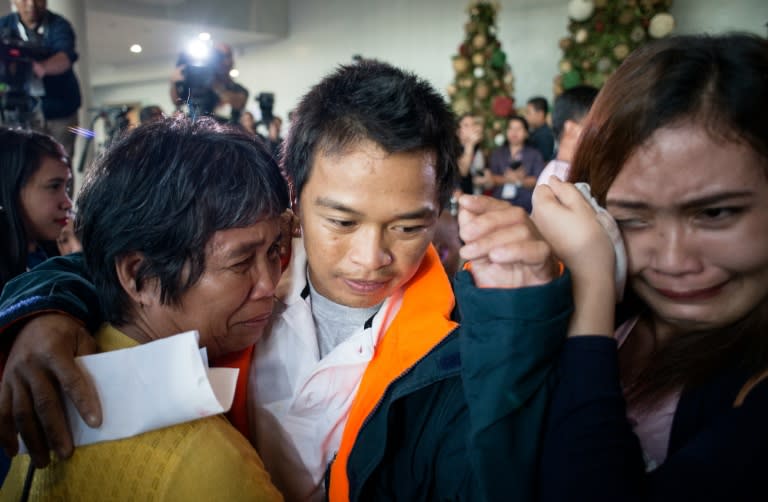 The Filipinos, most of them from poor farming families, arrived back on a flight from Kenya along with four Cambodian seafarers