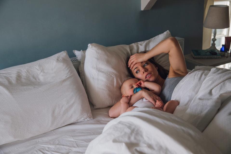 Research has shown that idealized portrayals of motherhood — clean house, happy kids, photo-ready hair and makeup — shared on social media increase anxiety and envy among some new moms. Getty Images