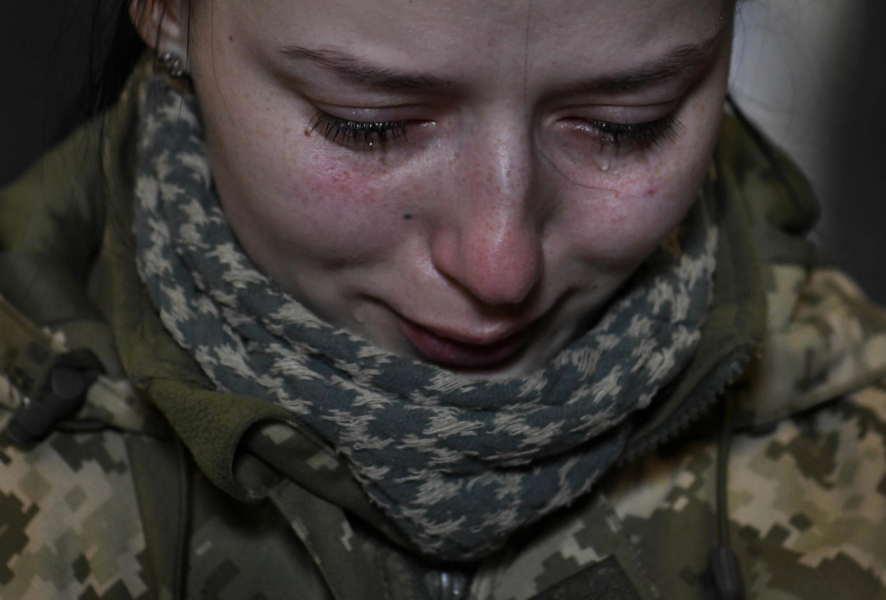 A female Ukrainian soldier seen crying.