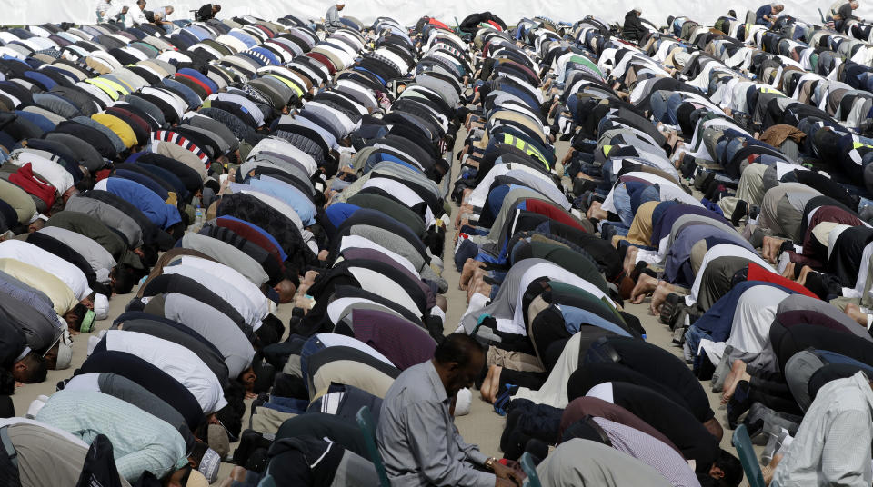 Muslims pray during Friday prayers at Hagley Park in Christchurch, New Zealand, Friday, March 22, 2019. People across New Zealand are observing the Muslim call to prayer as the nation reflects on the moment one week ago when 50 people were slaughtered at two mosques. (AP Photo/Mark Baker)