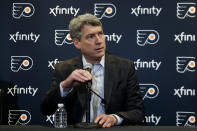 FILE - Philadelphia Flyers general manager Chuck Fletcher speaks to the media during an introductory press conference for head coach Alain Vigneault at the Flyer's practice facility in Voorhees, N.J., in this Thursday, April 18, 2019, file photo. The Flyers were a mess last season and general manager Chuck Fletcher knew it. He's traded five players and three draft picks in the last week and is trying to make them contenders again in the East. (AP Photo/Matt Slocum, File)