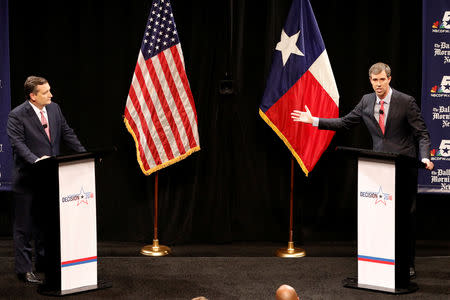 Republican U.S. Senator Ted Cruz (L), and Democratic U.S. Representative Beto O'Rourke hold their first debate for Texas U.S. Senate seat at the Southern Methodist University in Dallas, Texas, U.S., September 21, 2018. Nathan Hunsinger/The Dallas Morning News/Pool via REUTERS