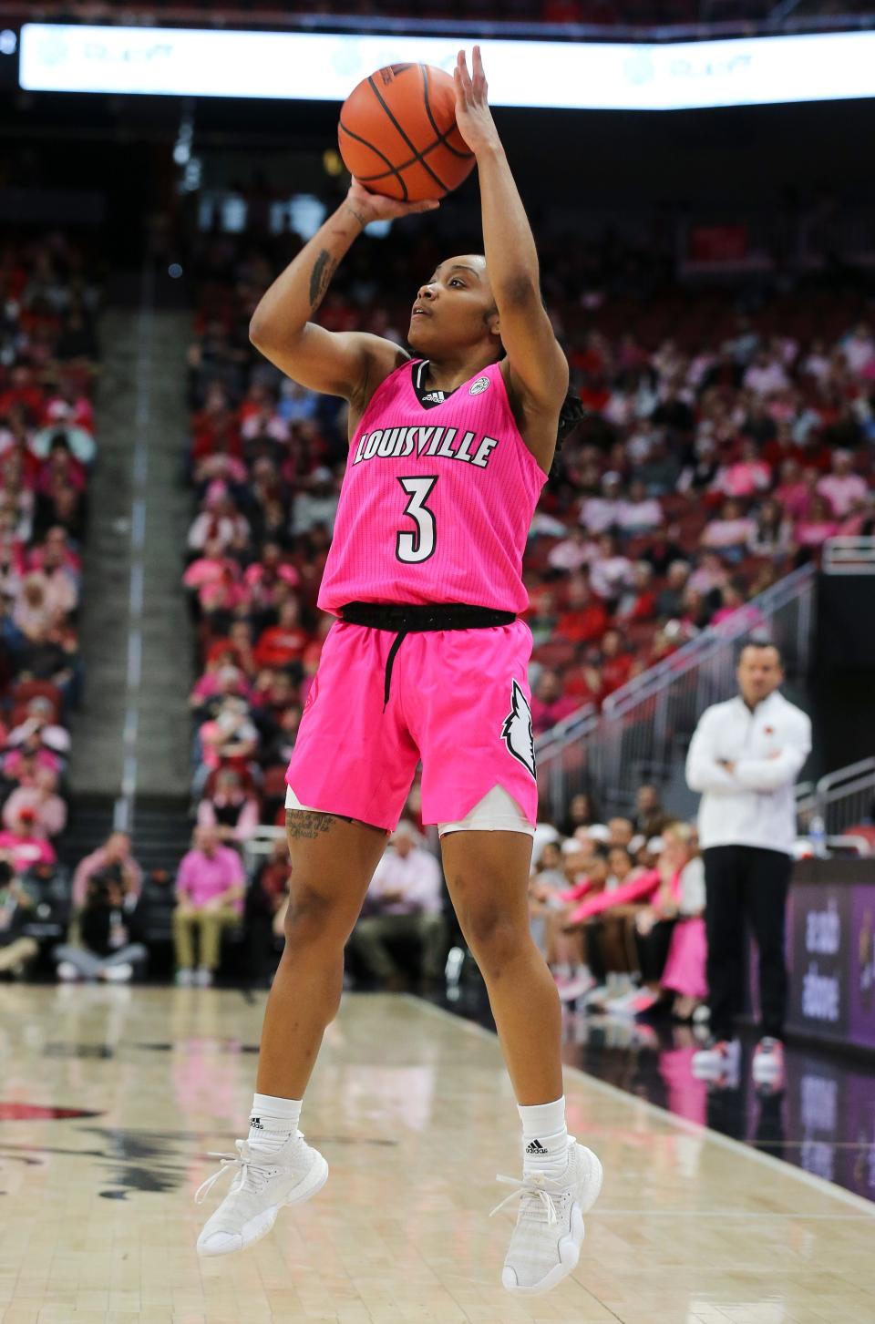 U of L's Chrislyn Carr (3) launches a three-point shot against North Carolina during their game at the Yum Center in Louisville, Ky. on Feb. 5, 2023.  U of L defeated No. 11 ranked UNC 62-55.