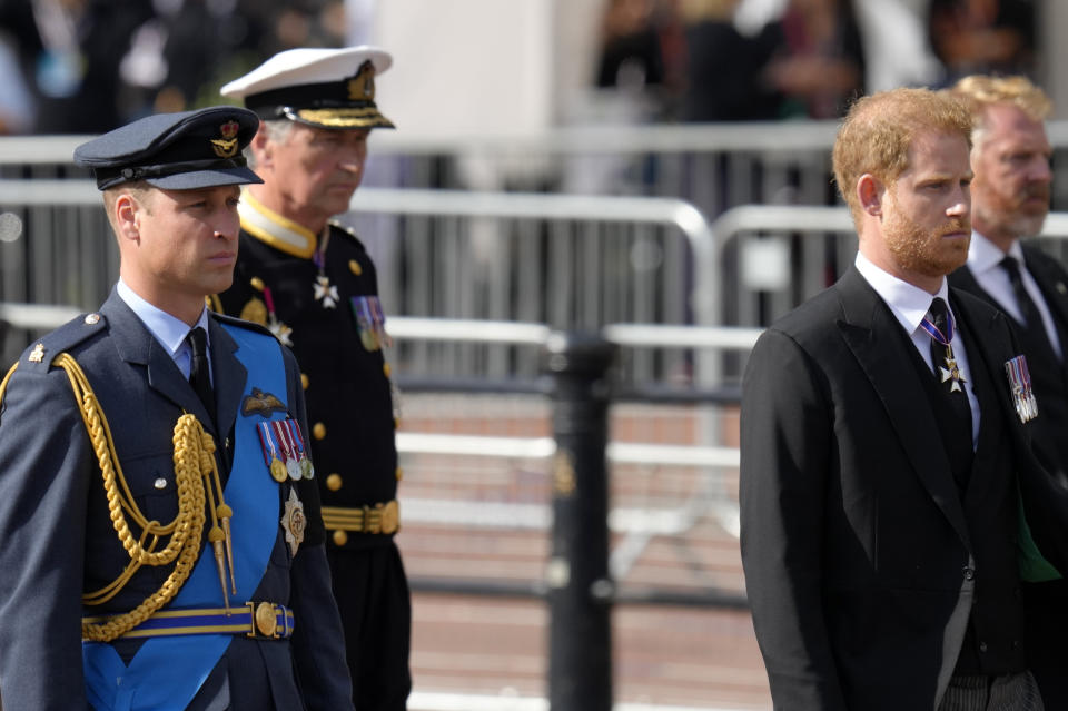 FILE - Britain's King Charles III, second left, Prince Harry, second right, and Prince William, left, follow the coffin of Queen Elizabeth II during a procession from Buckingham Palace to Westminster Hall in London, Wednesday, Sept. 14, 2022. King Charles III has been diagnosed with a form of cancer and has begun treatment, Buckingham Palace says on Monday, Feb. 5, 2024. (AP Photo/Kirsty Wigglesworth, File)