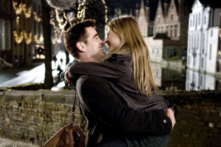 A man hugs a woman in In Bruges.