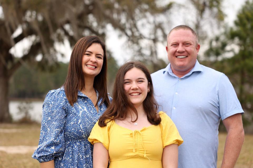 Tallahassee Firefighter Jeremy Rogers stands with his wife and daughter. Rogers is running for District 4 of the Leon County School Board.