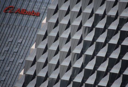 A logo of Alibaba Group is seen on a building under construction, where the company's Beijing headquarters will be, in Beijing, China, in this file picture taken October 15, 2015. REUTERS/Kim Kyung-Hoon/Files