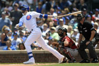 Chicago Cubs' Kris Bryant watches his two-run home run during the first inning of a baseball game against the Arizona Diamondbacks Sunday, July 25, 2021, in Chicago. (AP Photo/Paul Beaty)