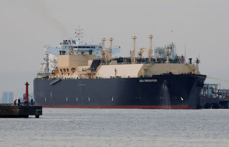 FILE PHOTO: A membrane-type liquefied natural gas (LNG) tanker is moored at a power station in Futtsu, east of Tokyo, Japan February 8, 2017. Picture taken February 8, 2017. REUTERS/Issei Kato/File Photo