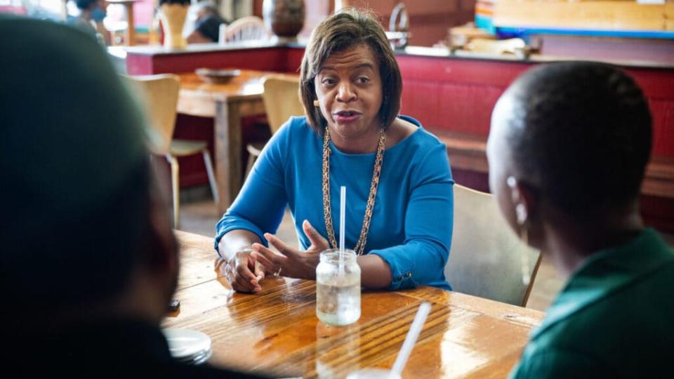Cheri Beasley, a Democratic U.S. Senate candidate, speaks with Leonardo and Zweli Williams, co-owners of Zwelis, a Zimbabwean restaurant, in Durham, North Carolina on July 7, 2021. (Photo by Allison Lee Isley for The Washington Post via Getty Images)