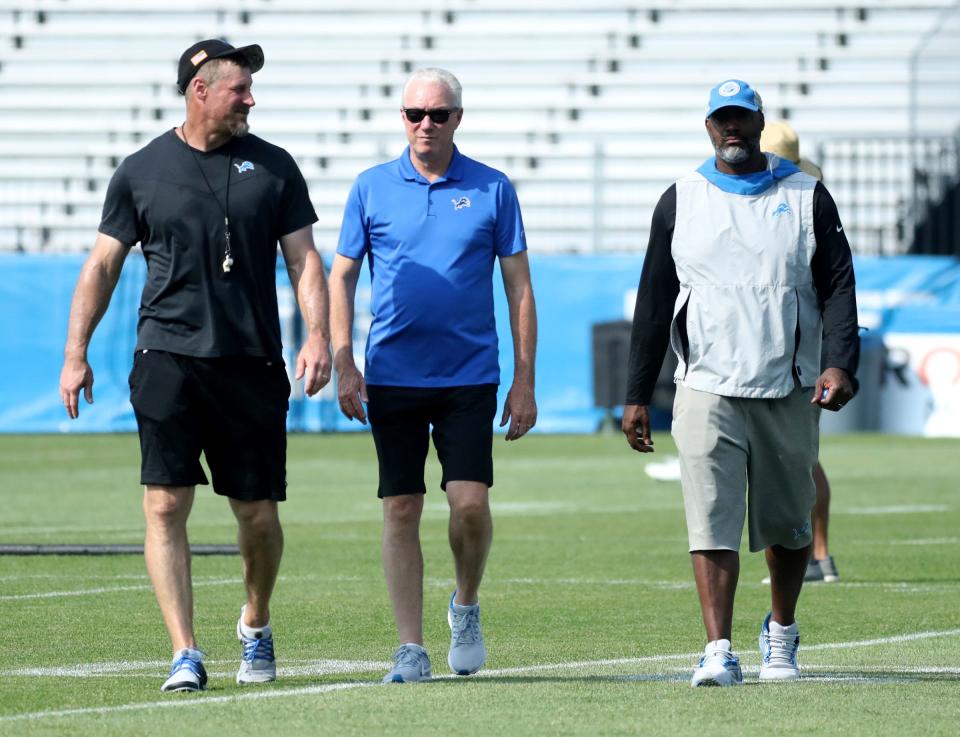 (From left) Lions coach Dan Campbell, team president Rod Wood and GM Brad Holmes walk off the field after training camp on Wednesday, July 26, 2023, in Allen Park.