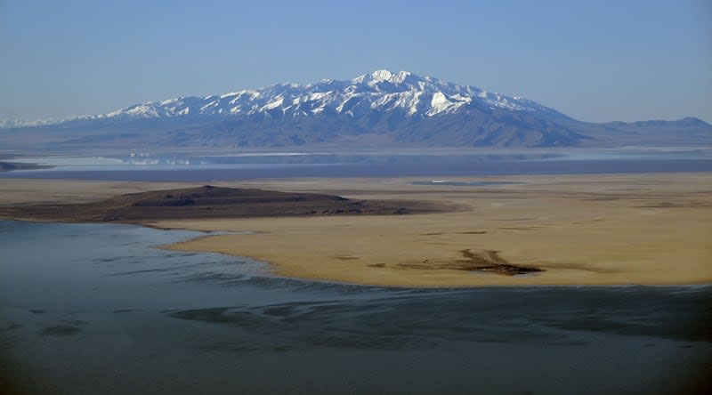 A snow-covered mountain peak is seen from a flight over the Great Salt Lake on April 9. About two-thirds of the Great Salt Lake Basin's snowpack has yet to melt, as of Wednesday. | Scott G Winterton, Deseret News