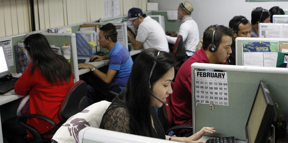 Call center agents work overnight daily to cater to United States clients in Manila&#39;s Makati financial district February 6, 2012. The number of Filipinos who work graveyard shifts to answer calls on behalf of big multinational companies like Citigroup and JPMorgan Chase is now greater than India&#39;s 350,000, earning the Philippine&#39;s the title - Call Centre Capital of the World. By 2016, the Philippines wants to double the size of the local BPO market to $25 billion, employing 1.3 million workers from 640,000 at the end of 2011. But to be able to that the Southeast Asian nation must convince investors it has more to offer than a huge pool of english-speaking talent. Picture taken February 6, 2012. To match Analysis OUTSOURCING/PHILIPPINES   REUTERS/Erik De Castro (PHILIPPINES - Tags: BUSINESS EMPLOYMENT)