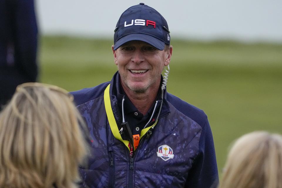 Team USA captain Steve Stricker smiles during a four-ball match the Ryder Cup at the Whistling Straits Golf Course Saturday, Sept. 25, 2021, in Sheboygan, Wis. (AP Photo/Jeff Roberson)