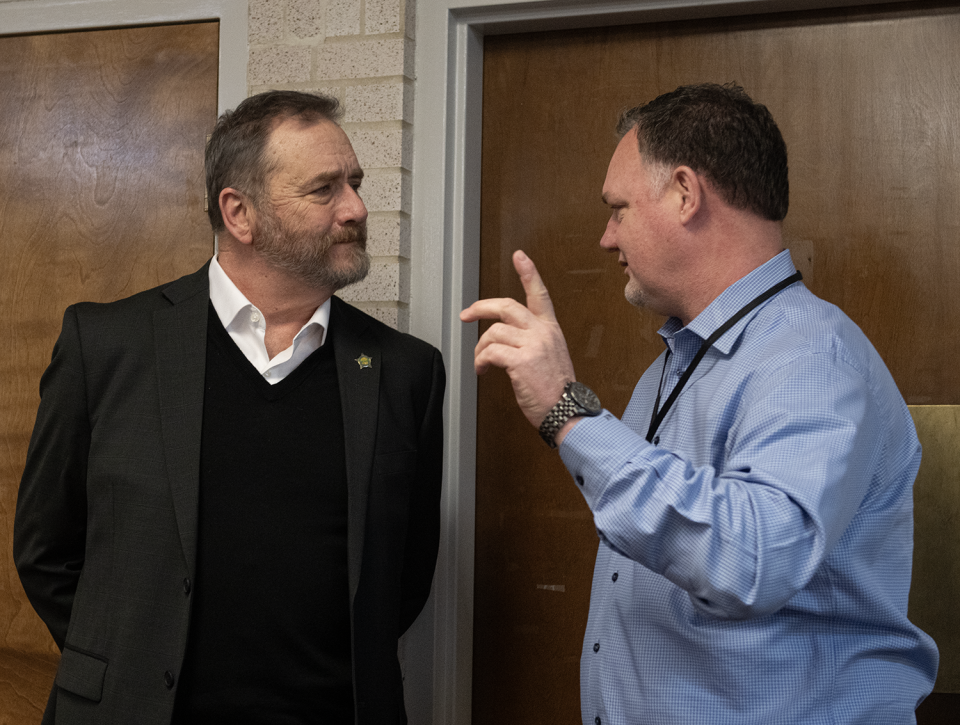 Ohio Attorney General Dave Yost, left, speaks with Portage County Auditor Matt Kelly on Thurday, March 7, 2024, at Center of Hope in Ravenna. The center received a portion of a $1 million settlement with Dollar General.