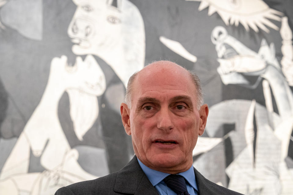 Bernard Ruiz-Picasso, grand son of Pablo Picasso, talks to reporters in front of Pablo Picasso's "Guernica" painting after a news conference to present the "Picasso Year" events, marking the 50th anniversary of the painter's death, at the Reina Sofia Museum in Madrid, Spain, Monday, Sept. 12, 2022. Against the backdrop of Picasso's iconic anti-war painting, "Guernica," the culture ministers of France and Spain have gathered in Madrid to kick off a year of commemorative acts to celebrate the 50th anniversary of the death of the Spanish artist who revolutionized the world of art. (AP Photo/Andrea Comas)