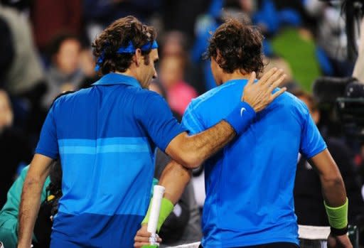 Roger Federer (left) and Rafael Nadal walk off the court after Federer defeated Nadal in the final of the BNP Paribas Open in Indian Wells, California., in March. Federer won a 17th Grand Slam title this summer with a seventh Wimbledon to match the mark of Pete Sampras