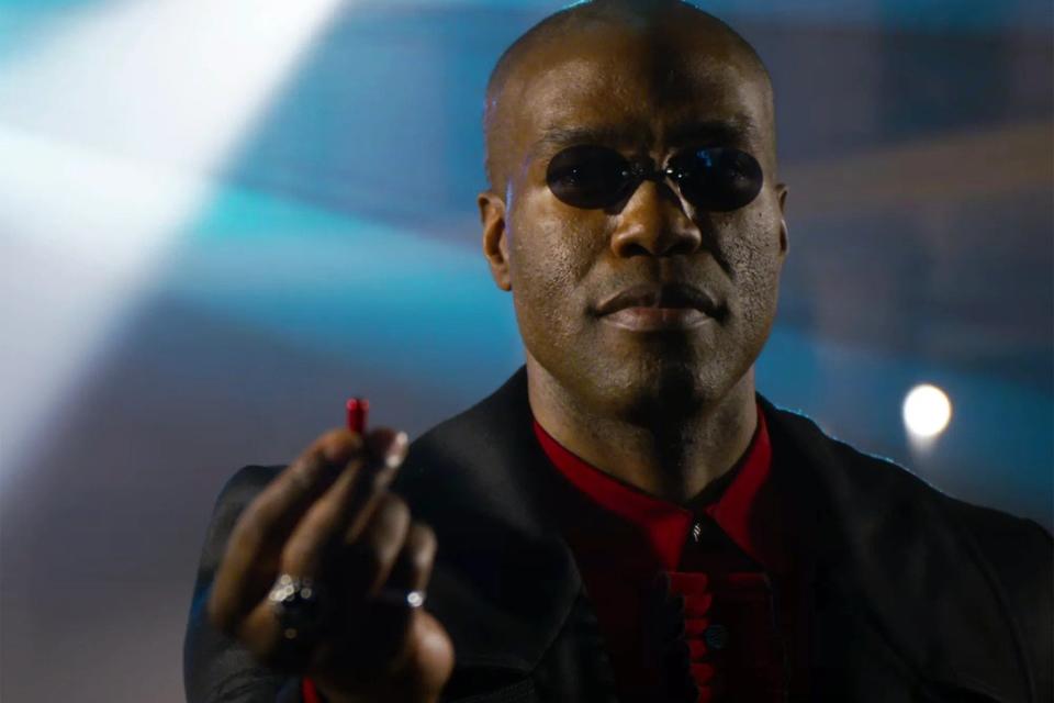 Yahya Abdul-Mateen II in a suit with dark sunglasses