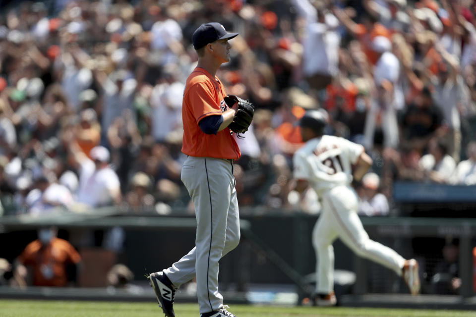 San Francisco Giants' LaMonte Wade Jr, right, rounds the bases after hitting a two-run home run against Houston Astros' Zack Greinke during the fifth inning of a baseball game in San Francisco, Saturday, July 31, 2021. (AP Photo/Jed Jacobsohn)