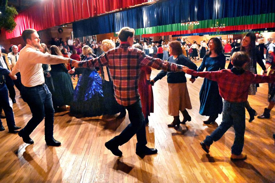 Dancers join hands as the circle during the Texas Cowboys’ Christmas Ball in Anson Dec. 14. This was the 89th reenactment of the 1885 dance.