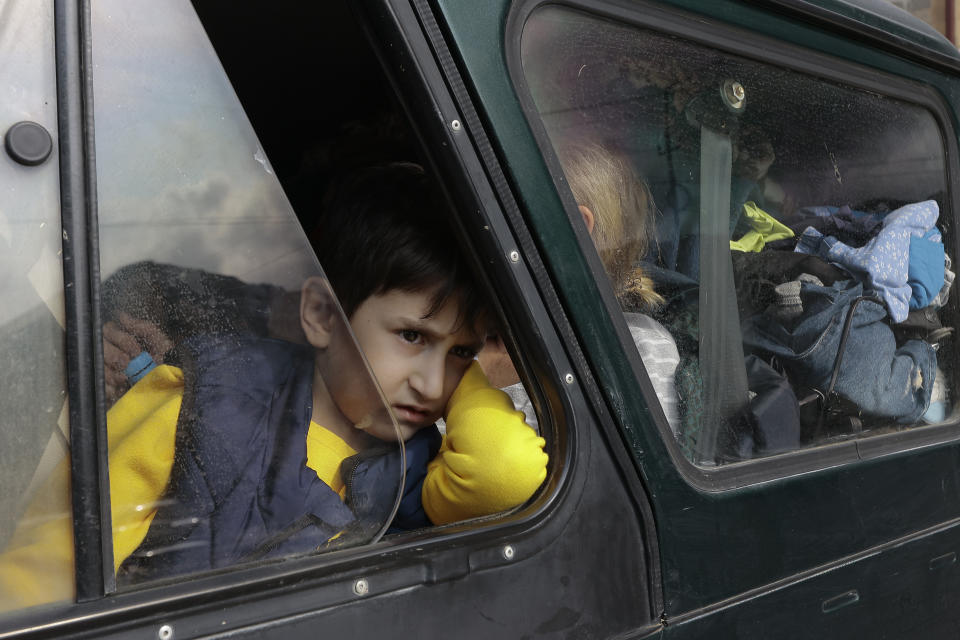 FILE - An ethnic Armenian boy from Nagorno-Karabakh, looks out from a car upon his arrival in Goris, the town in Syunik region, Armenia, Sept. 25, 2023. Thousands of Nagorno-Karabakh residents are fleeing their homes after Azerbaijan's swift military operation to reclaim control of the breakaway region after a three-decade separatist conflict. (AP Photo/Vasily Krestyaninov, File)
