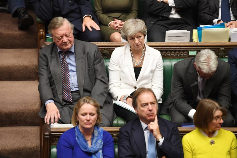 Britain's Conservative MP and former prime minister Theresa May listens during a debate on Brexit in London