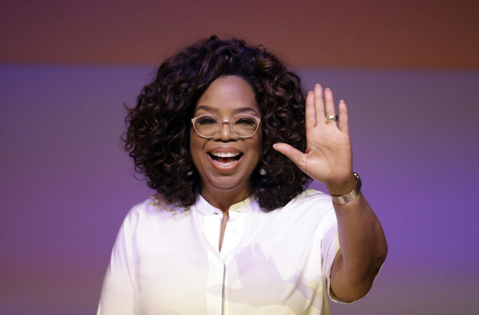 Oprah Winfrey waves the audience during a tribute to Nelson Mandela and promoting gender equality event at University of Johannesburg in Soweto, South Africa, Thursday, Nov. 29, 2018. (AP Photo/Themba Hadebe)