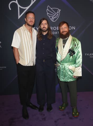 <p>Gabe Ginsberg/Getty </p> Imagine Dragons' Dan Reynolds, Wayne Sermon and Ben McKee in Las Vegas in October 2023