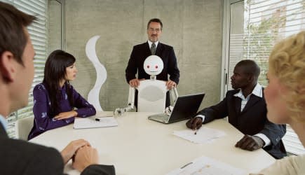 Robot and group of executives meeting in conference room