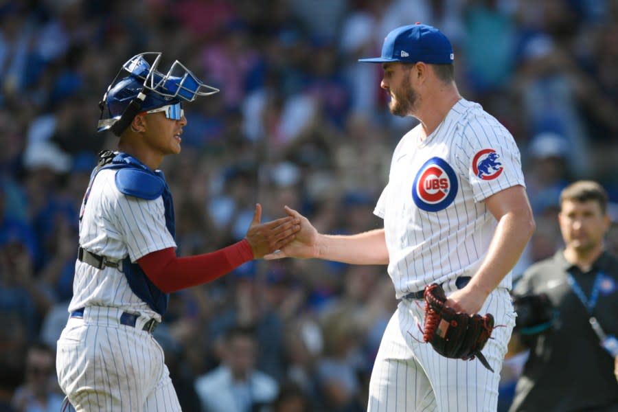 Chicago Cubs closing pitcher Luke Little right, celebrates with catcher Miguel Amaya left, after defeating the San Francisco Giants 8-2 in a baseball game Wednesday, Sept. 6, 2023, in Chicago. (AP Photo/Paul Beaty)