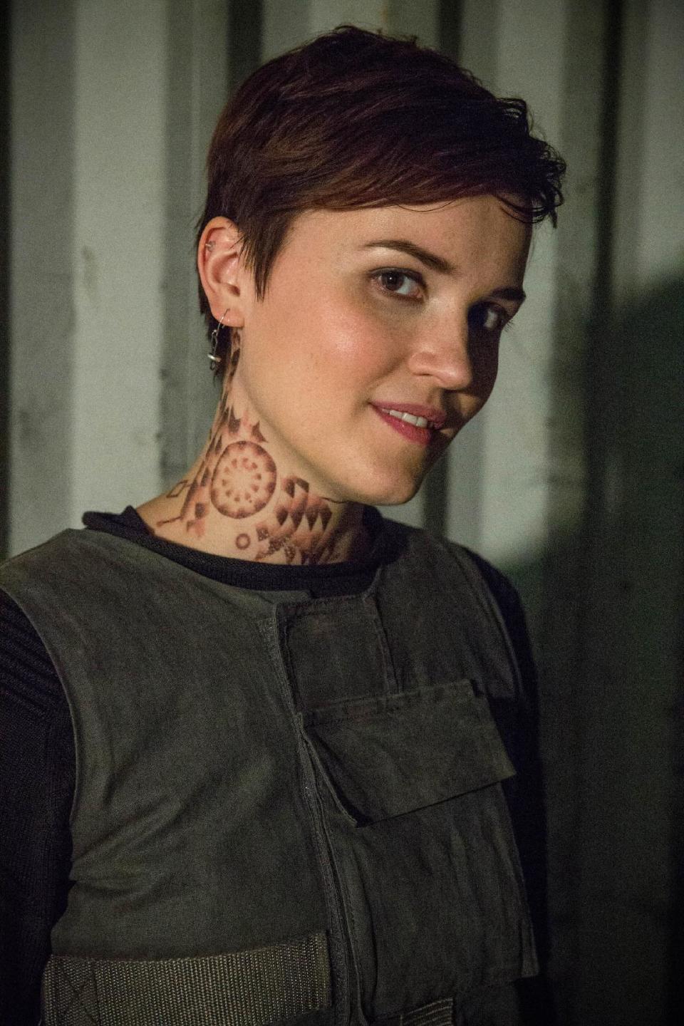 This photo released by Summit Entertainment shows, author Veronica Roth, on the set of the film, "Divergent." The movie releases on Friday, March 21, 2014. (AP Photo/Summit Entertainment, Jaap Buitendijk)