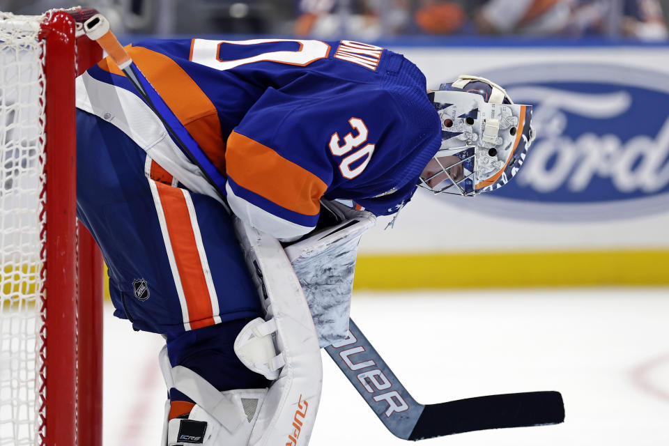 New York Islanders goaltender Ilya Sorokin pauses during the third period of the team's NHL hockey game against the Carolina Panthers on Thursday, Oct. 13, 2022, in Elmont, N.Y. The Panthers won 3-1. (AP Photo/Adam Hunger)