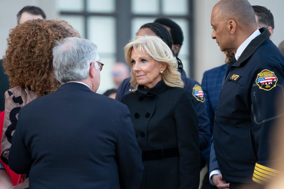 First Lady Dr. Jill Biden (center) talks with Mayor John Cooper (lt) and Nashville Fire Chief William Swann during the Nashville Remembers candlelight vigil to mourn and honor the victims of The Covenant School mass shooting at Public Square Park Wednesday, March 29, 2023 in Nashville, Tenn. 