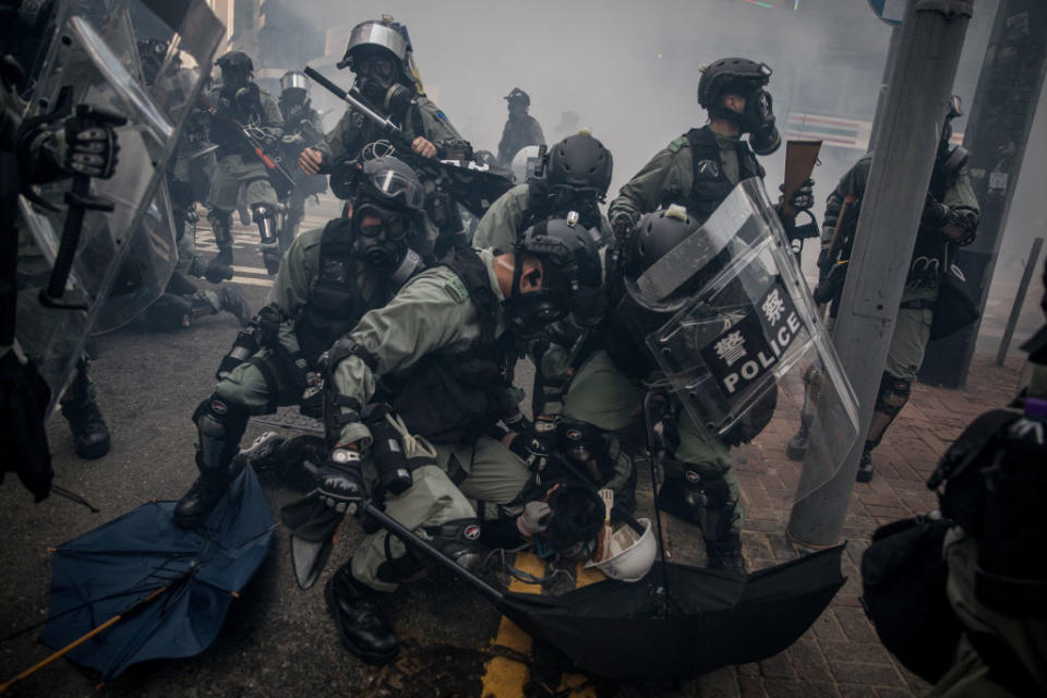 Police tackle and arrest pro-democracy protesters during clashes Tuesday. Source: Getty Images