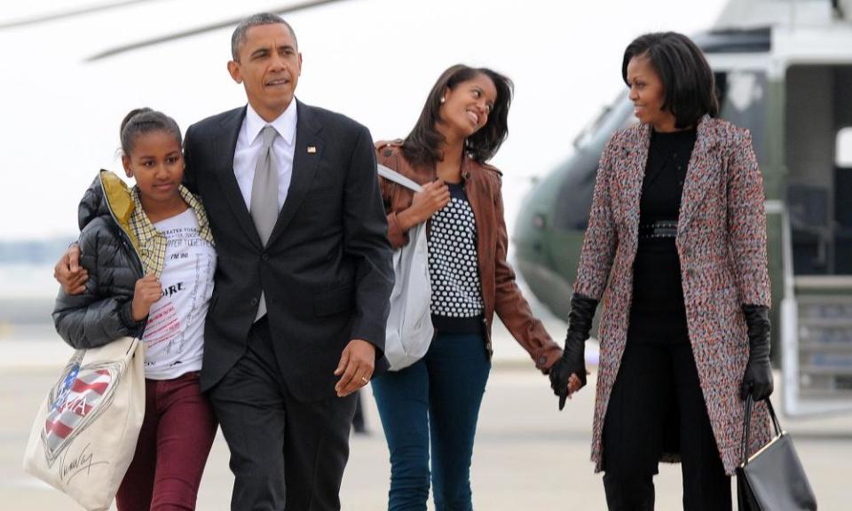 Barack Obama, pictured with wife Michelle and daughters Sasha and Malia, is the poster-boy of “Peak Dad”