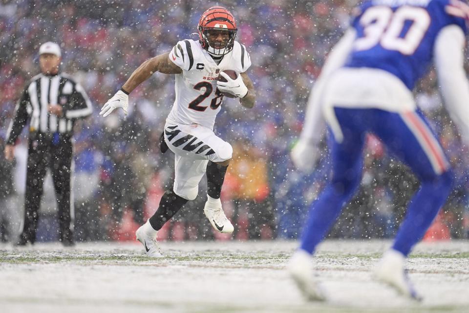 ORCHARD PARK, NY - JANUARY 22: Joe Mixon #28 of the Cincinnati Bengals runs with the ball against the Buffalo Bills during the first half at Highmark Stadium on January 22, 2023 in Orchard Park, New York. (Photo by Cooper Neill/Getty Images)