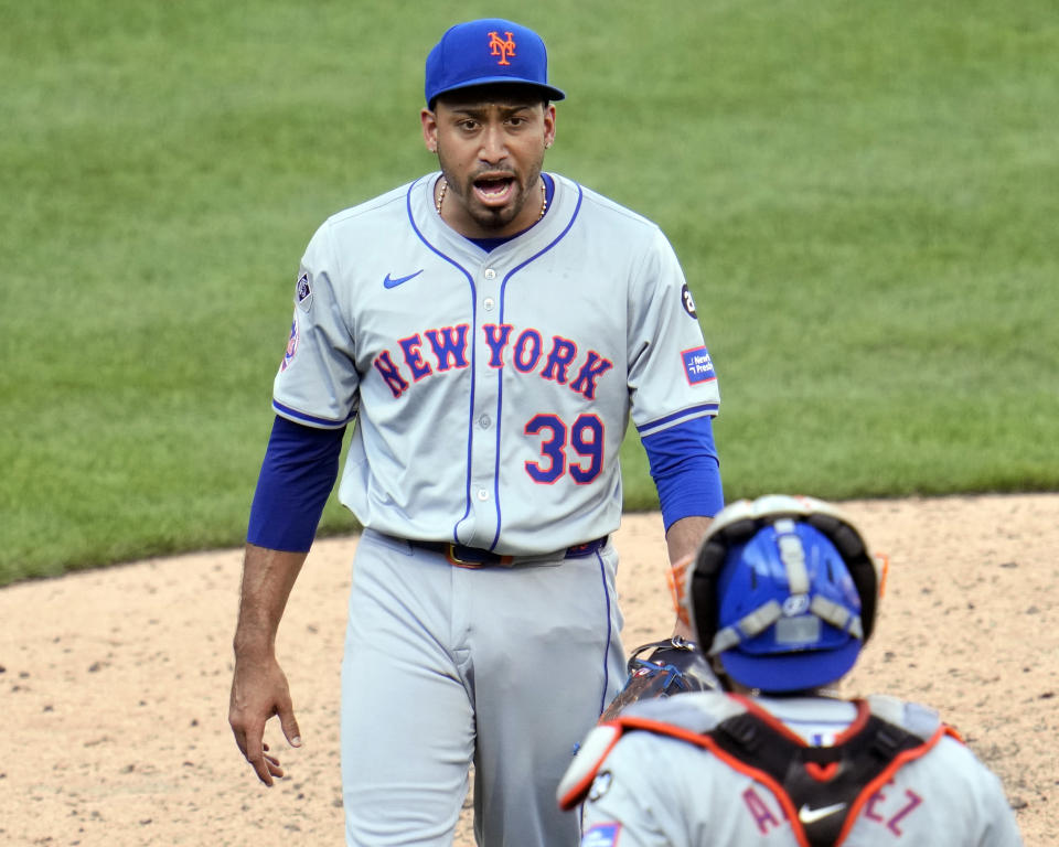 New York Mets relief pitcher Edwin Diaz (39) celebrates with catcher Francisco Alvarez, bottom, after getting the final out of a baseball game against the Pittsburgh Pirates in Pittsburgh, Saturday, July 6, 2024. (AP Photo/Gene J. Puskar)