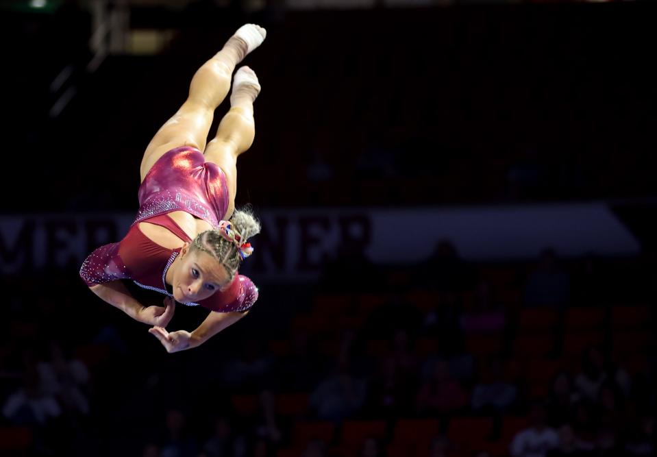 OU's Ragan Smith dismounts the beam during the Big 12 women's gymnastics championships on March 23 at Lloyd Noble Center in Norman.